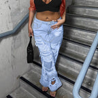 Women high-cut heavily ripped denim jeans with wide leg and decorative seam panels Fashion Glam