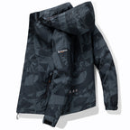 Men's technical waterproof hooded jacket with graphic camouflage print, zippered pockets, and adjustable hem Fashion Glam