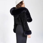 Women's short bolero made of bouclé faux fur with voluminous hood and fur cuffs Fashion Glam
