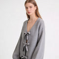 Women's Oversized Knit Cardigan with Deep V-Neck and Decorative Bows Fashion Glam