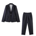 Women's pinstripe long blazer with a slightly oversized fit and decorative single-button closure