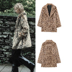 Women's faux fur coat in oversized cut with lapel collar, tie belt and pockets Fashion Glam