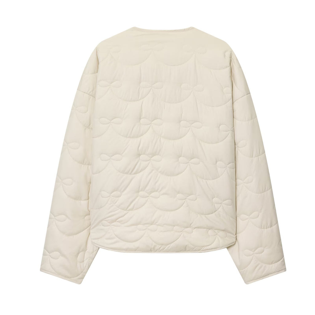 Women's short cut quilted jacket with round neckline and tonal bow quilting Fashion Glam