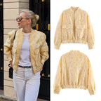 Women's short cut quilted bomber jacket with floral jacquard texture, elastic hem and patch pockets Fashion Glam