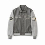 Men's varsity bomber jacket in collegiate style with faux leather body, suede look sleeves and embroidered patches Fashion Glam