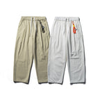 Unisex locker cut cropped leisure pants with elastic waistband, drawstring, and carabiner detail Fashion Glam