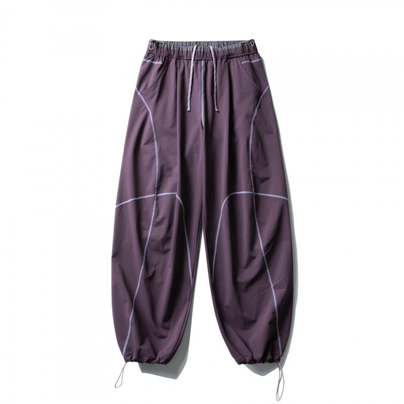 Unisex locker cut tech jogging pants with elastic waistband, distinctive flatlock seams and drawstring Fashion Glam