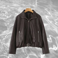 Women’s cropped oversized leather jacket in bomber style with zippered pockets and waist belt Fashion Glam
