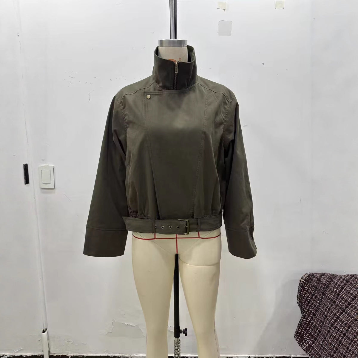 Women's short jacket with high stand-up collar, concealed zipper, and waist belt Fashion Glam