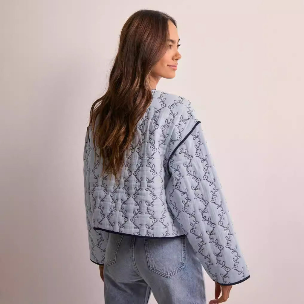 Women's lightweight quilted blouse jacket with V-neck, contrast piping and floral line print Fashion Glam