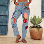 Ladies straight-cut jeans with colorful floral appliqués and light destruction details Fashion Glam