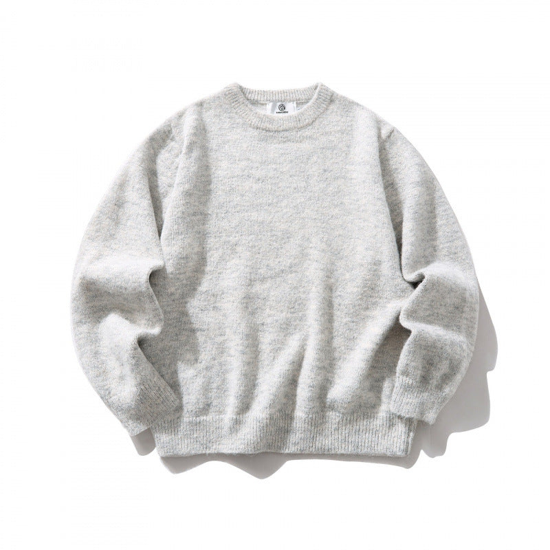 Unisex Oversize fine knit sweater with round neckline, ribbed cuffs, and mottled wool blend Fashion Glam