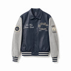 Men's varsity bomber jacket in collegiate style with faux leather body, suede look sleeves and embroidered patches Fashion Glam