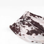 Women's loosely cut shirt blouse with cow spot print and concealed button placket Fashion Glam