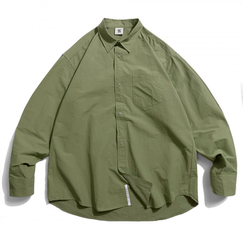 Unisex Oversize Shirt made of lightweight cotton blend with dropped shoulder and chest pocket Fashion Glam