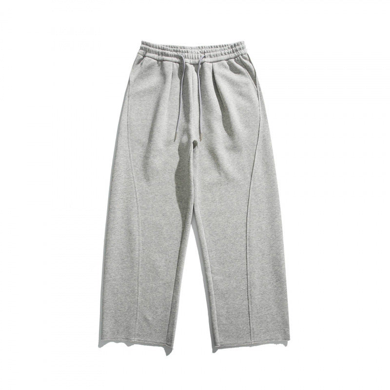 Unisex Loose Cotton Fleece Jogging Pants with Drawstring, Decorative Front Seams and Raw Hem Fashion Glam