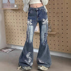 Women's wide flared cargo-style jeans with decorative ribbons, lace appliqués, and multiple pockets Fashion Glam
