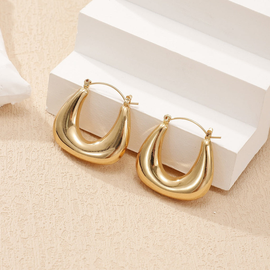 Ladies earrings in a modern, curved design Fashion Glam