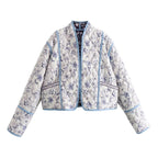 Women's quilted short jacket in kimono style with floral quilted look and contrasting piping Fashion Glam