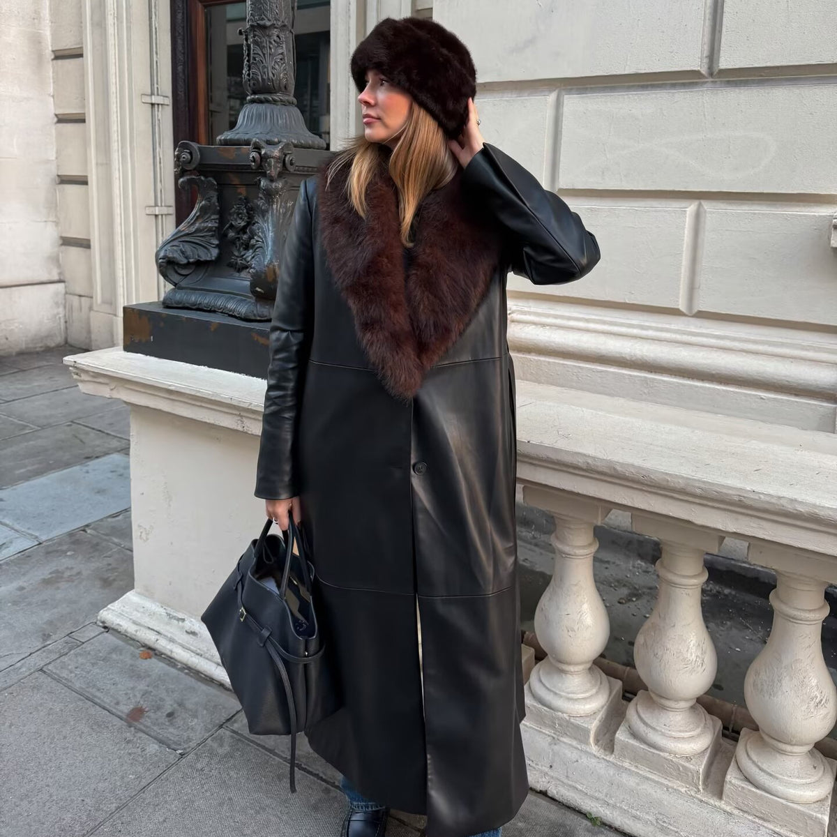 Ladies Longer Leather Coat with Voluminous Fur Collar and Minimalist Silhouette Fashion Glam