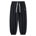 Men's Loose Fit Jogging Pants with Drawstring, Elastic Waistband and Sewn Knee Areas Fashion Glam