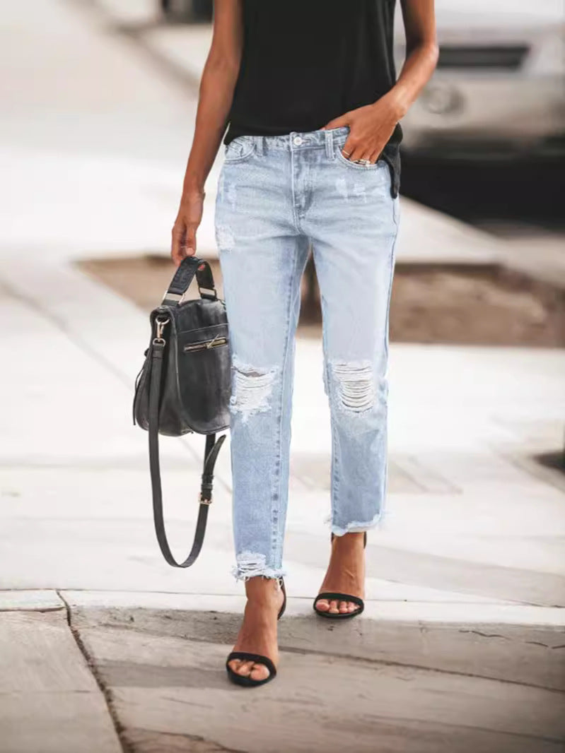 Women's Ripped Denim Jeans with Casual Cut and Frayed Hem Fashion Glam