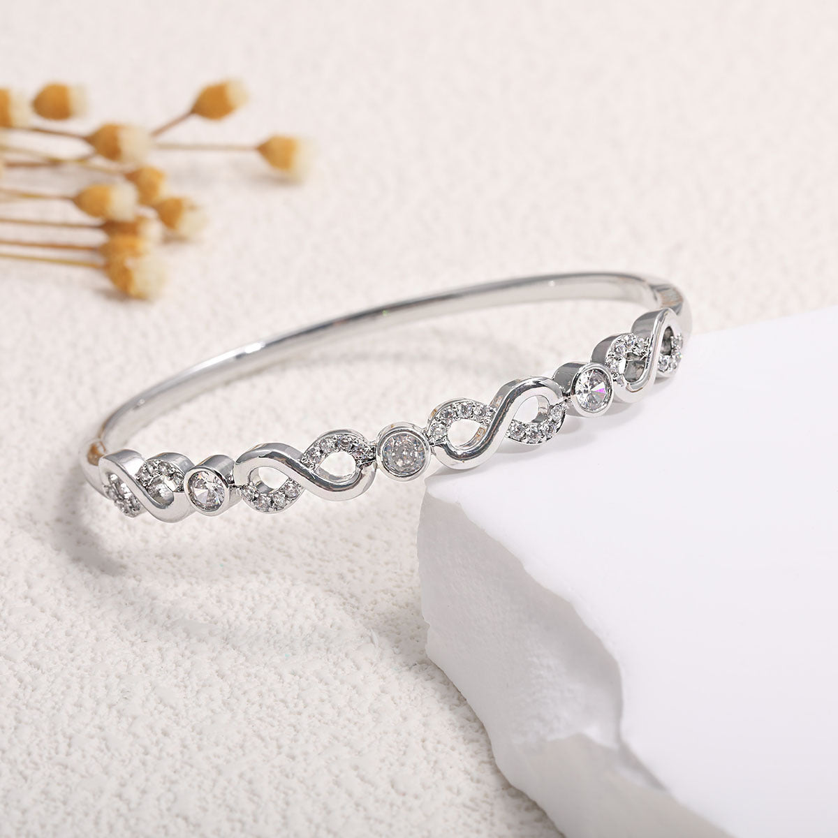 Ladies bracelet with elaborate infinity symbol and sparkling zirconia Fashion Glam
