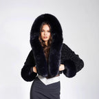 Women's short bolero made of bouclé faux fur with voluminous hood and fur cuffs Fashion Glam