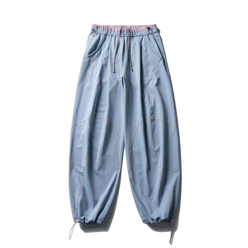 Unisex locker cut tech jogging pants with elastic waistband, distinctive flatlock seams and drawstring Fashion Glam