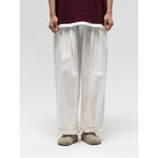 Women Wide High-Waist Pleated Pants with Elastic Drawstring and Cuffed Hem Fashion Glam