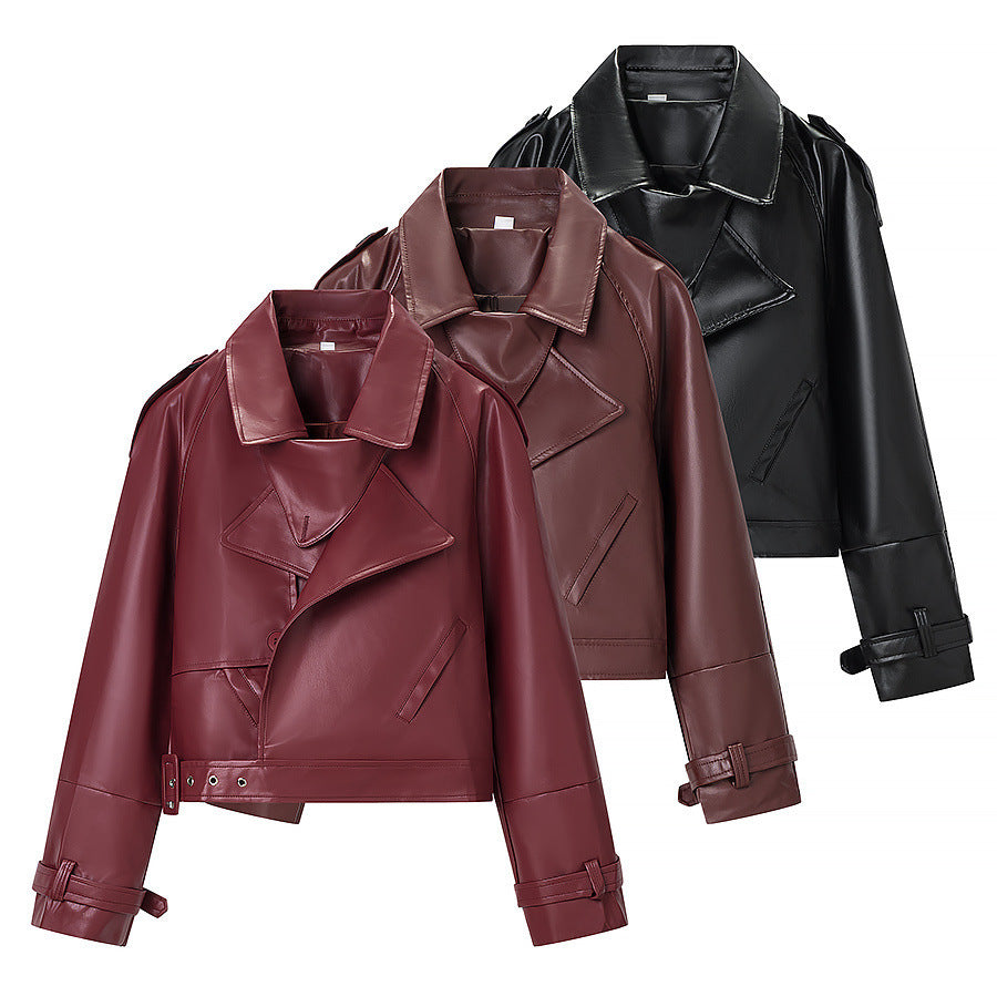Ladies short cut biker jacket made of faux leather with asymmetrical front and waist belt Fashion Glam