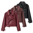 Ladies short cut biker jacket made of faux leather with asymmetrical front and waist belt Fashion Glam