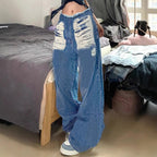 Women's high-cut wide denim jeans with heavily distressed front and raw waistband Fashion Glam