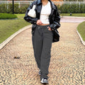 Women high-waisted loose-fitting jeans with wide legs and asymmetrical button placket Fashion Glam