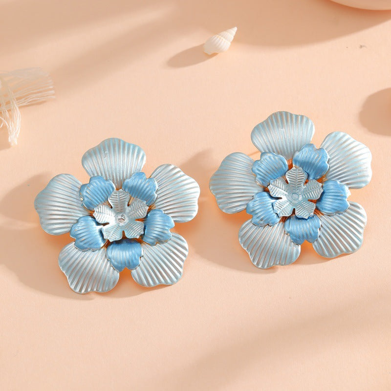 Ladies' flower earrings with intricate design and glossy accents Fashion Glam