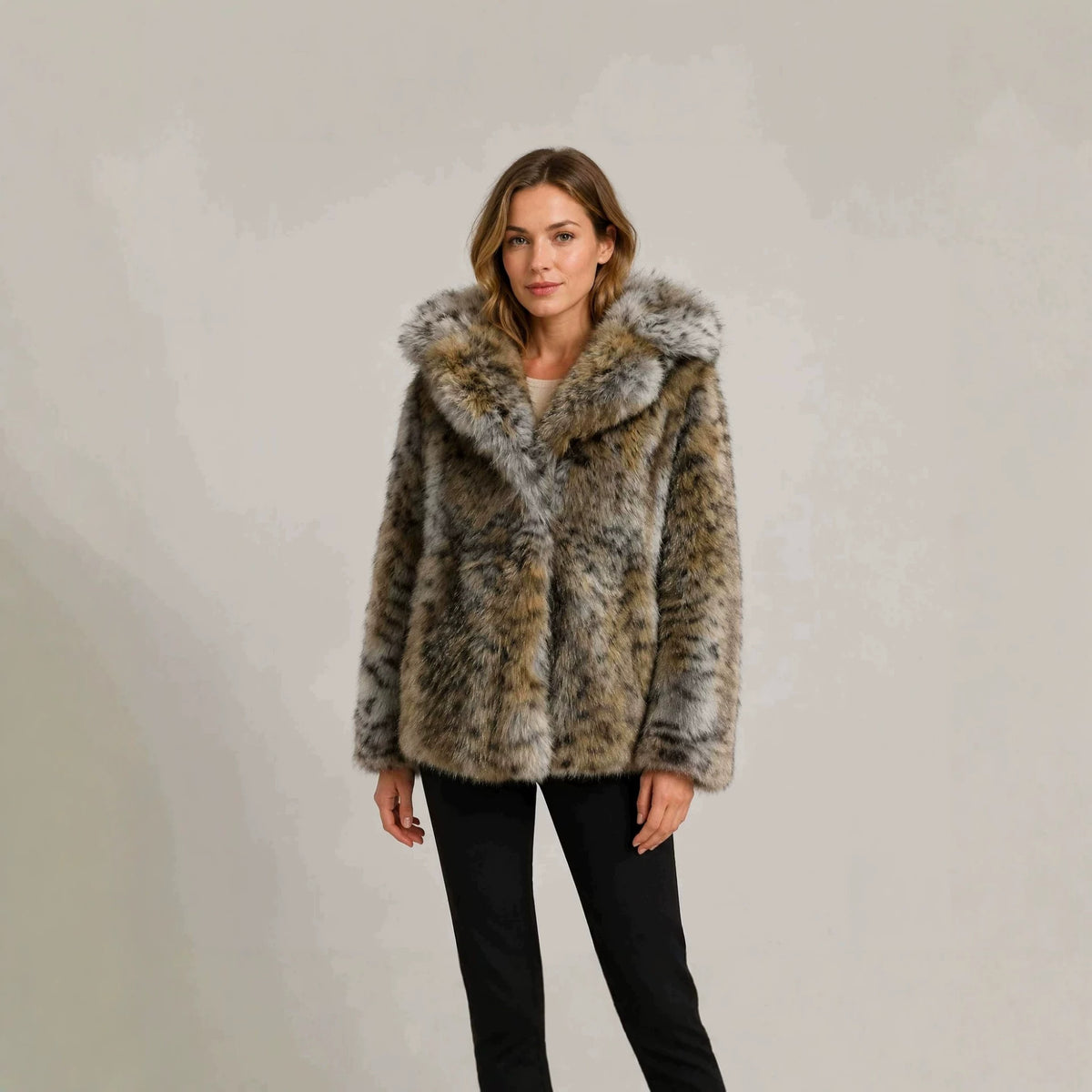 Women's short jacket made of high-quality faux fur with a hood and concealing boxy silhouette Fashion Glam