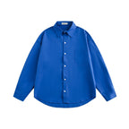 Unisex Loose-fitting oversized shirt made of cotton blend with Kent collar, chest pocket, and rounded hem Fashion Glam