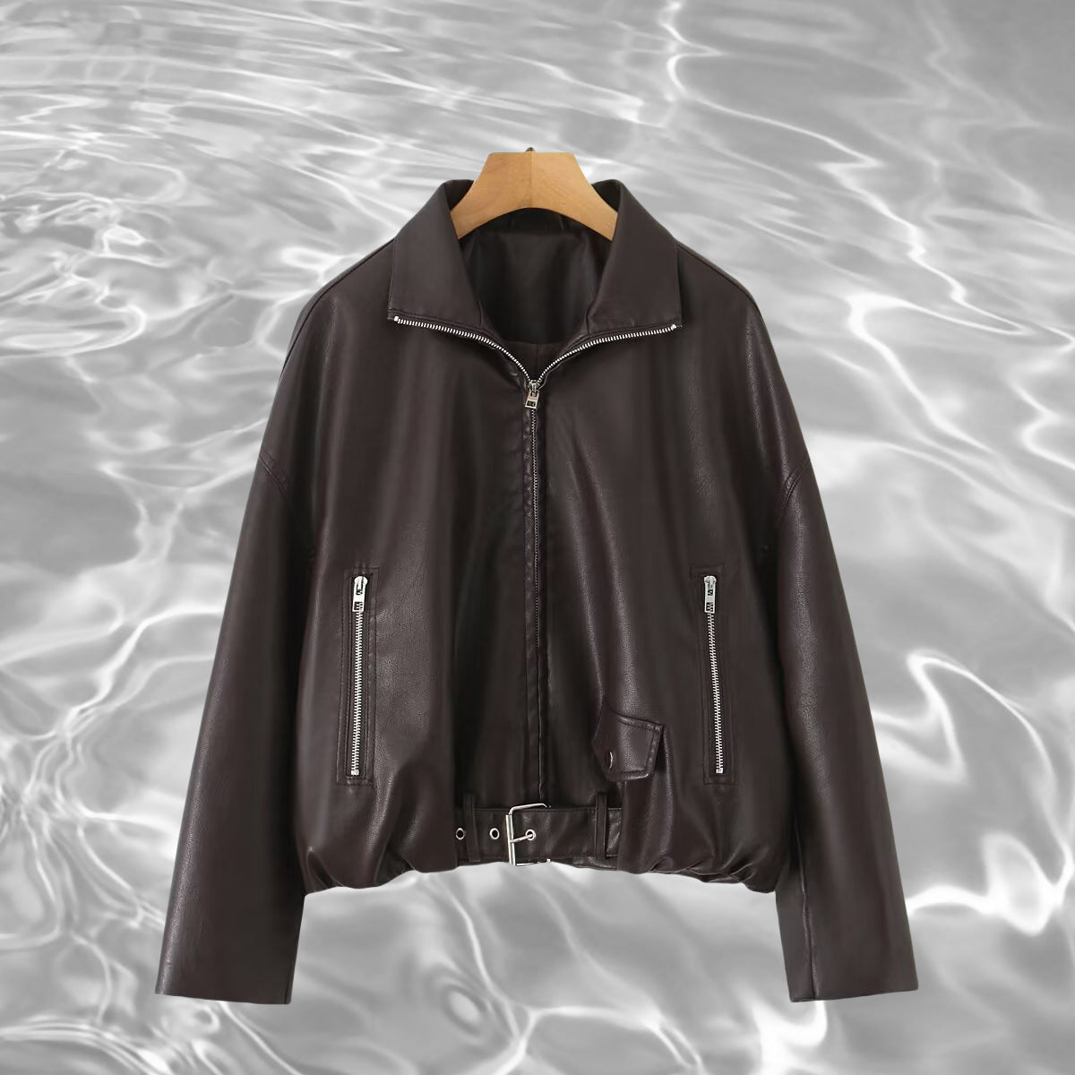 Women’s cropped oversized leather jacket in bomber style with zippered pockets and waist belt Fashion Glam
