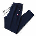 Men's Slim-Fit Jogging Pants with Elastic Ribbed Waistband, Drawstring and Zipper Pockets Fashion Glam