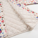Women Lightweight Quilted Transitional Jacket with Floral Allover Print, Round Neck and Flap Pockets Fashion Glam