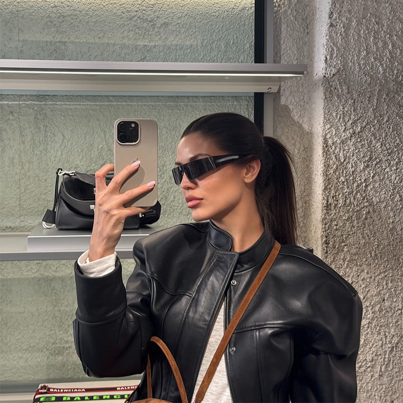 Women's short jacket in biker-bomber style made of vegan leather with a stand-up collar and oversized sleeves Fashion Glam