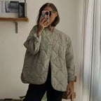 Women's oversized quilted jacket in cocoon cut with wave-shaped quilting and round neckline Fashion Glam