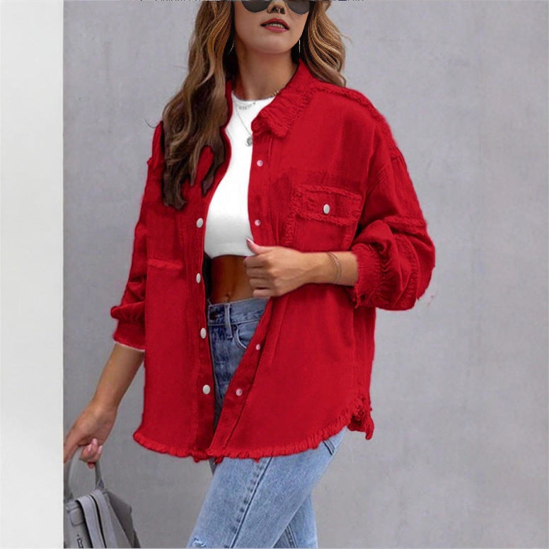 Women's oversized denim shirt jacket with fringe trim, flap pockets, and snap front Fashion Glam