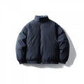 Unisex Boxy quilted transitional jacket with standing collar, elastic hem and zipper pockets Fashion Glam