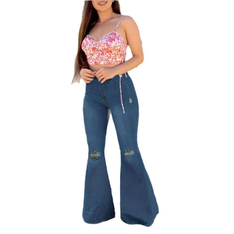 Women’s figure-hugging flared jeans with retro flair, featuring distressed knees and a waist-shaping comfort waistband Fashion Glam
