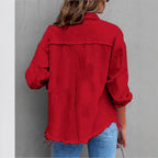 Women's oversized denim shirt jacket with fringe trim, flap pockets, and snap front Fashion Glam