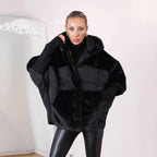 Women's short quilted jacket in cocoon cut with voluminous faux fur trim and hood Fashion Glam