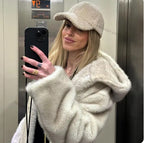 Women's hooded coat made of faux fur with a waist belt and extra soft teddy finish Fashion Glam