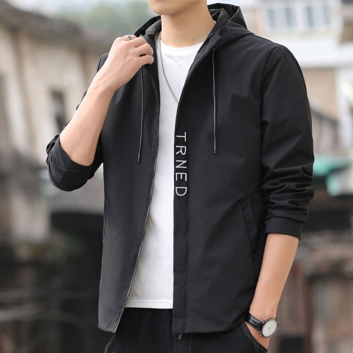 Men's lightweight hooded shell jacket with concealed zipper and minimalist utility look Fashion Glam