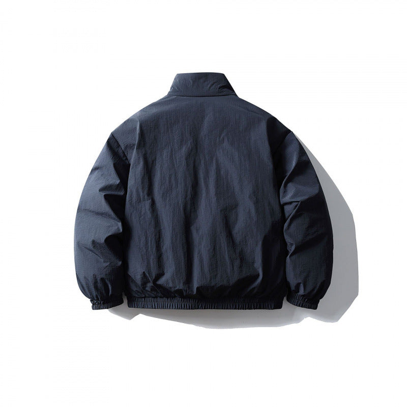 Unisex Boxy quilted transitional jacket with standing collar, elastic hem and zipper pockets Fashion Glam